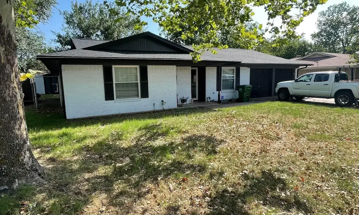 Professional roofing crew working on a residential roof in Black Jack